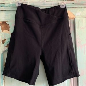 Long ribbed black workout shorts with crisscross pattern in front